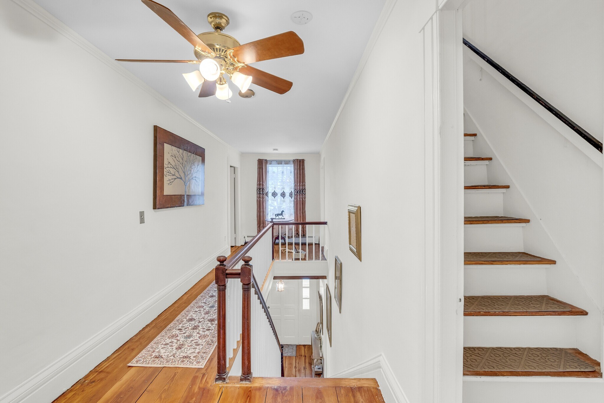 2nd floor hallway. You can see stairs to 3rd floor on right. - 205 Main St