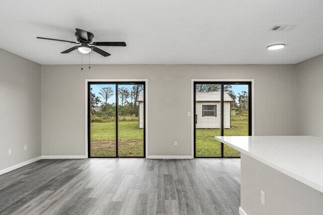 Building Photo - Charming Palm Bay Retreat - Perfect for Relaxation and Entertainment!