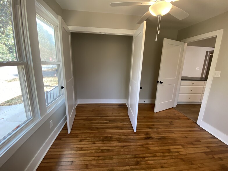 Front bedroom, huge closet, refinished original hardwoods, ceiling fan, USB, USBC - 1524 Ward Ave NE