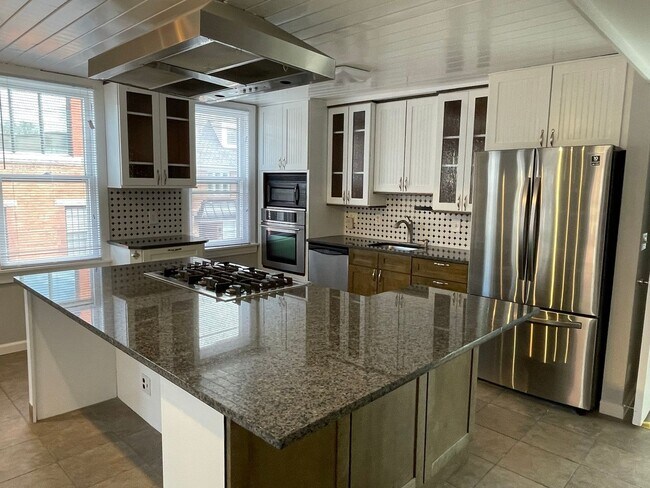Building Photo - Small pets are welcome with an additional ...