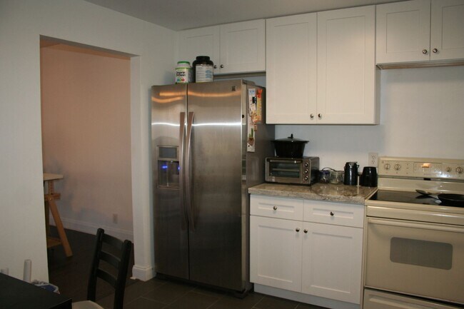 Building Photo - Pretty, Huge, Updated Townhome