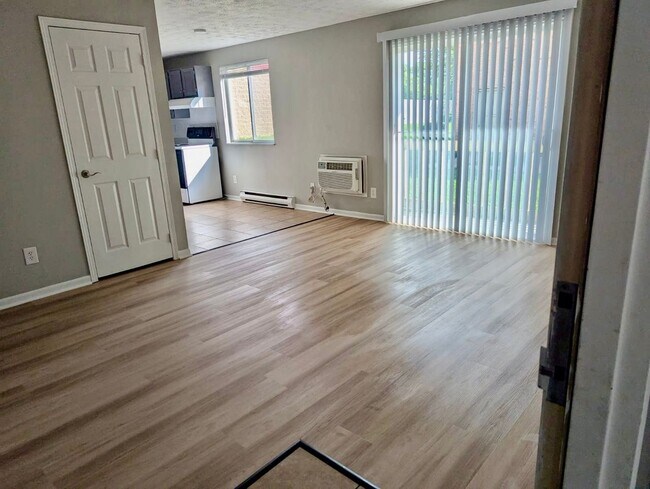 Building Photo - ONE MONTH FREE! Ask us how! A Fresh Start: Renovated 2-Bedroom in Serene Englewood with Washer/Dr...