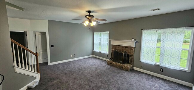 Building Photo - Commanding Curb Appeal, Conveniently Place