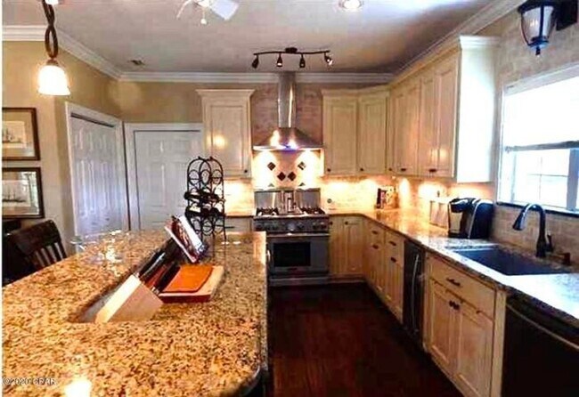 Building Photo - WATERFRONT W/BOAT SLIP!!!! This beautiful home is located in a gated community on North Lagoon Dr...