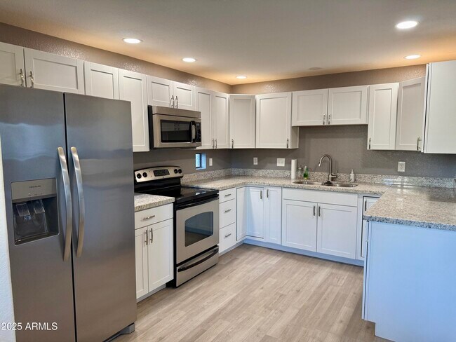 Building Photo - 9555 E Raintree Dr