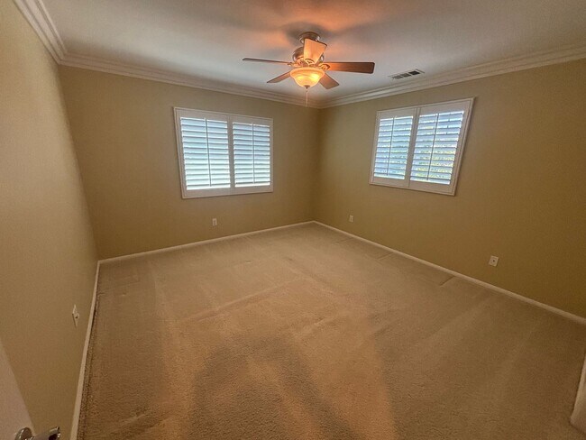 Building Photo - Spacious 4-Bedroom Home with Community Ame...