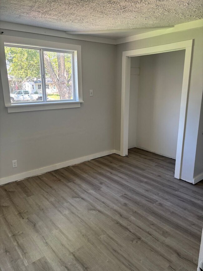 Building Photo - Perfect Home for You and Your Pup! Dog House Included + Fenced Yard