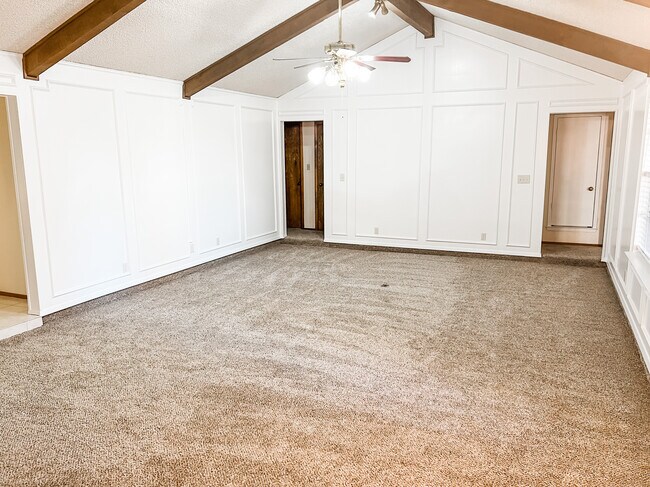 Living room off main entry. New carpet in entire home. Freshly painted living room. - 400 Pine Dr