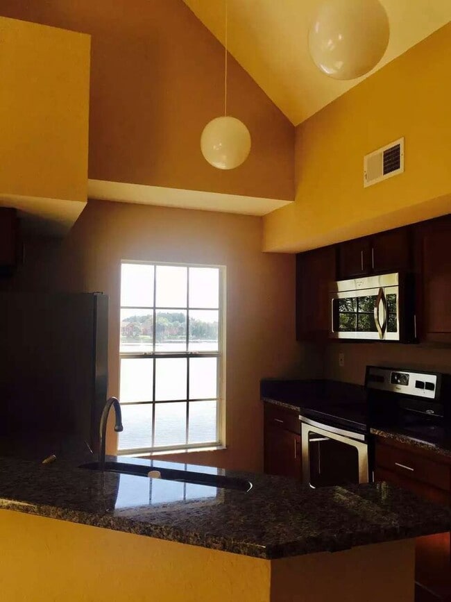 Building Photo - Water view condo with garage in sought after westchase