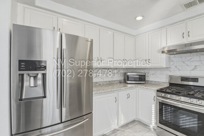 Building Photo - SE!!! 4 Bedrooms!! Master Downstairs!! No Carpet!! Synthetic Grass front and back!!