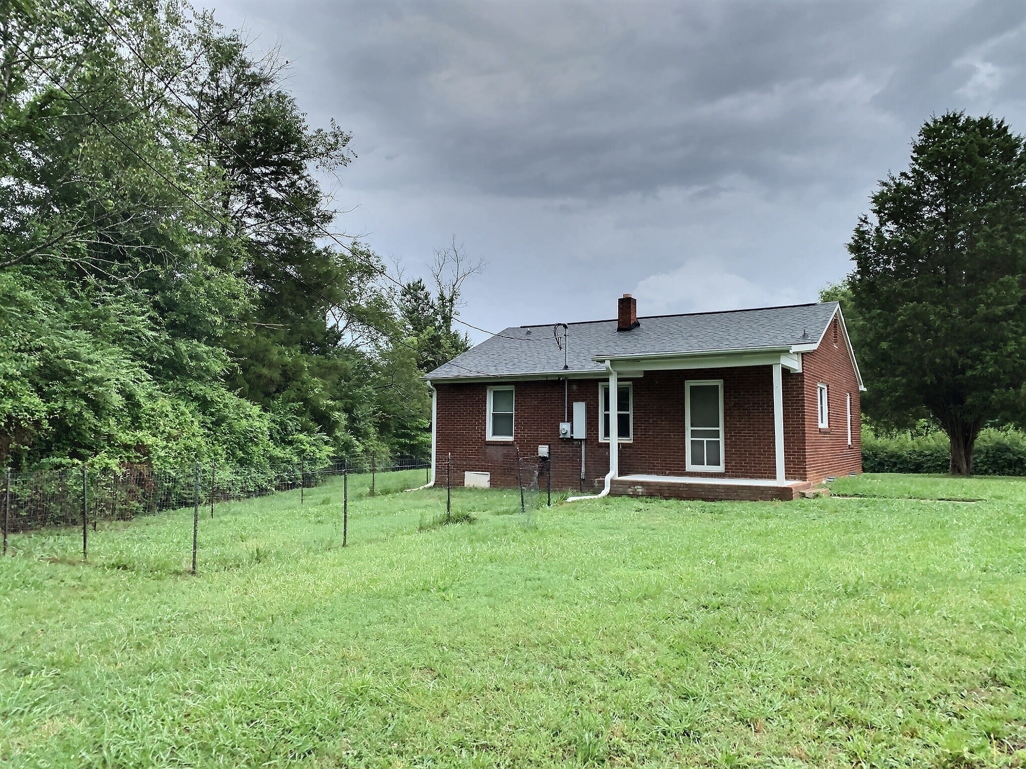 -this fence has been removed for more yard space. - 1447 Miles Rd