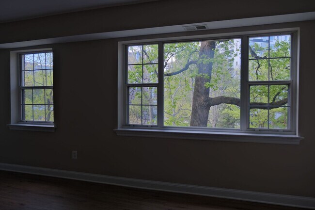 Building Photo - Beautiful corner unit in a secure, all-brick, pet-friendly building