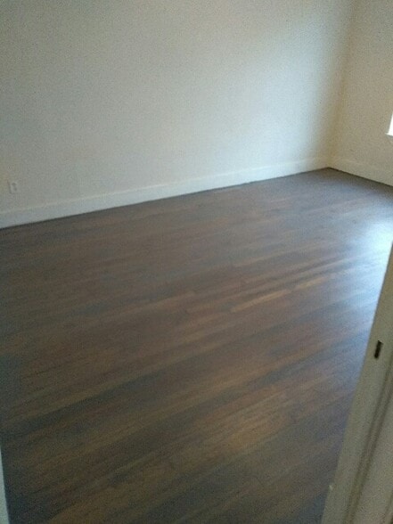 Refinished original hardwood floors throughout duplex - 1131 W Lynwood Ave