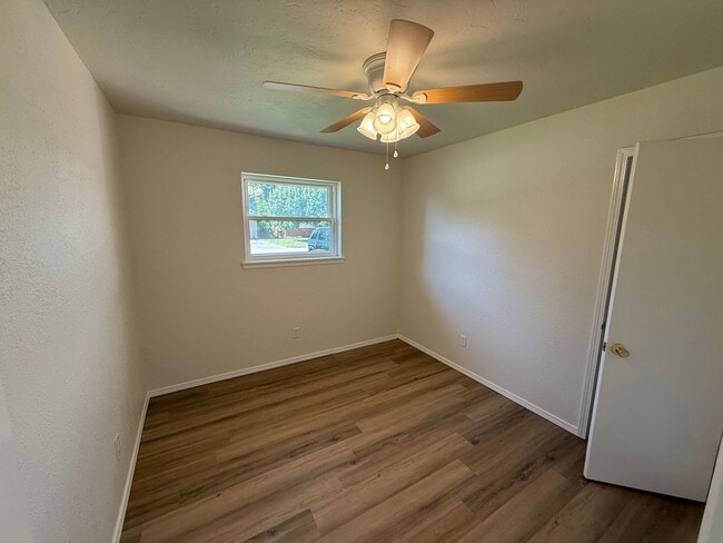 Building Photo - Brand new appliances, flooring, paint, and...