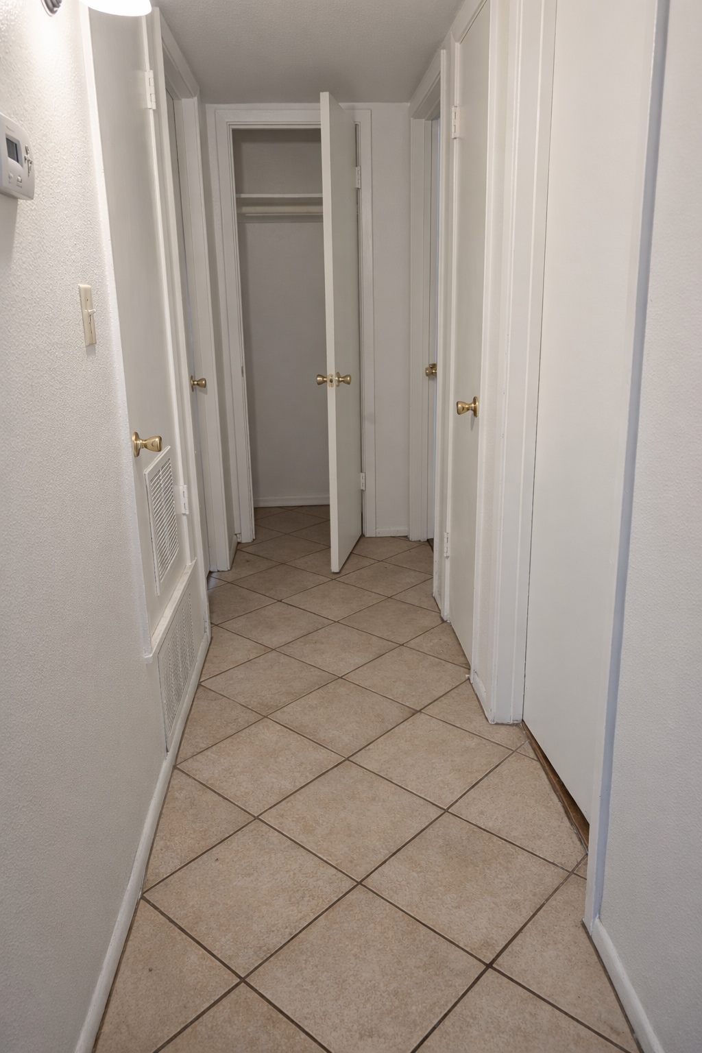 Hallway with 3 closets - 715 W 18th St