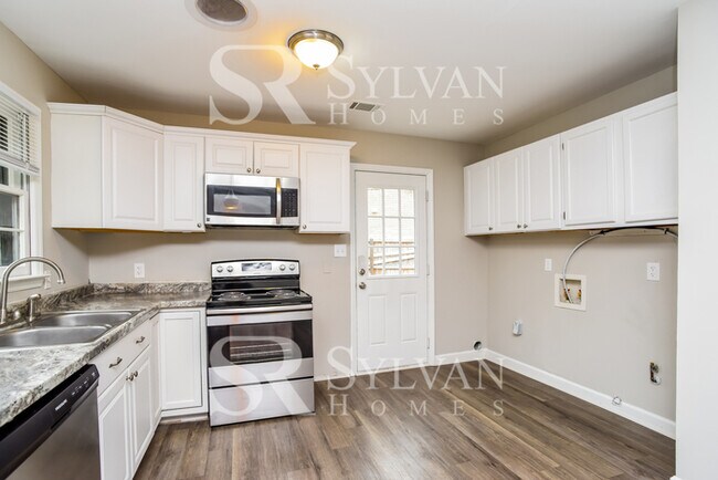 Building Photo - You'll love this charming brick home!