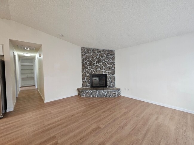 Building Photo - Charming Single-Level Home Featuring New Hardwood Floors, Bright Bedrooms & Open-Concept Living