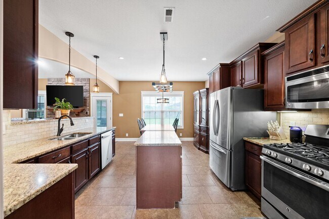 Building Photo - Spacious 4-Bedroom Home with Dual Living A...