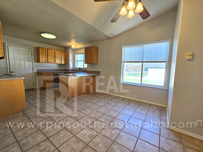 Building Photo - Spacious & Updated 2 Bedroom, 2 Bathroom Twin Home in Ammon with Garage, Fenced Backyard, and Hoo...