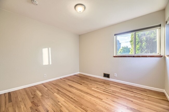 Building Photo - Spacious Home w/Large Backyard Only Blocks...