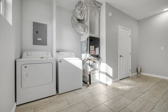 Building Photo - Modern Comfort Meets Prime Location — Stylish 2-Story Townhome