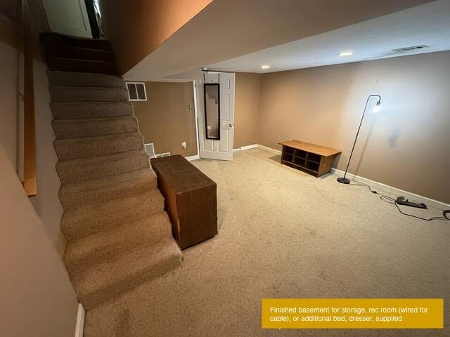 Finished basement convertible to bed, rec room, laundry through far door - 1723 N Cliff St