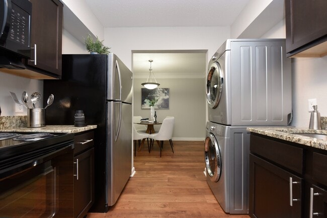 Kitchen with in-home washer & dryer - The Preserve at Crestwood