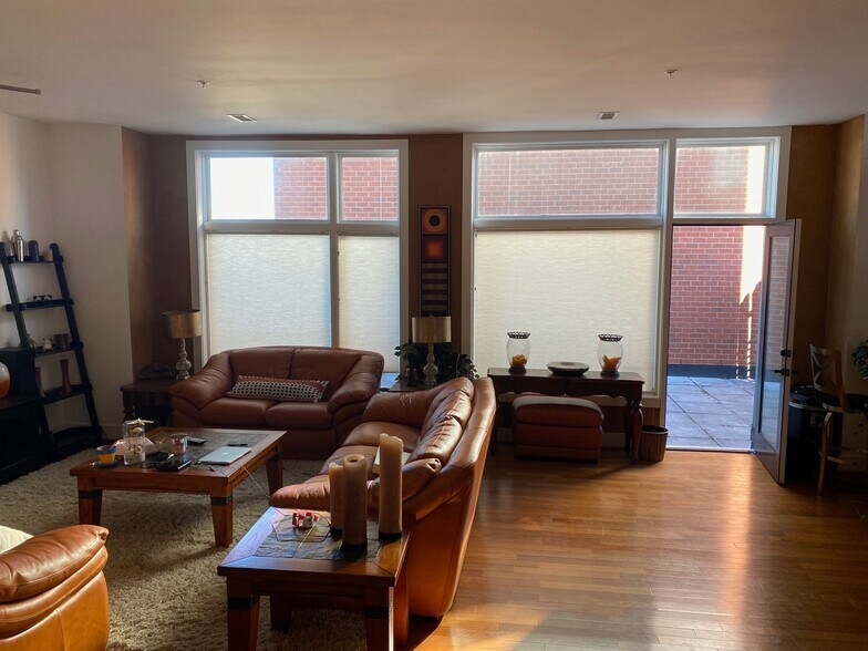 Living room view - private deck is located per door in living room - 1714 W Cary St
