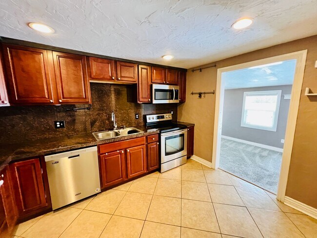 Building Photo - UNIVERSITY HILLS, CHARMING RANCH HOME, UPDATES THROUGHOUT, 3 BED, LARGE YARD, DECK AND PERGOLA .