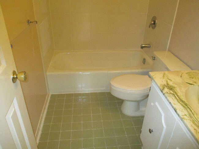 Building Photo - SPACIOUS BRICK TOWN-HOME