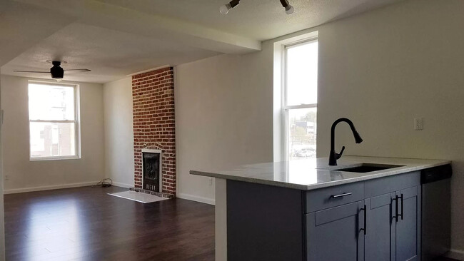 Great Room Looking Towards the Kitchen and Antique Fireplace - 4410 Swan Ave