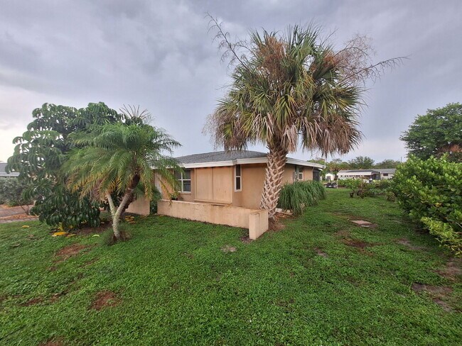 Building Photo - Gulf Access Home on Canal Available Now