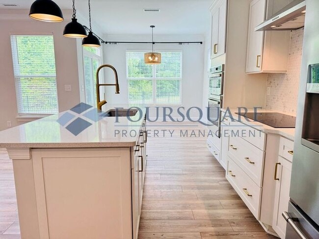 Building Photo - End-Unit Townhome with Fenced Yard, Washer/Dryer included & 2-Car Garage – Comfortable & Convenie...