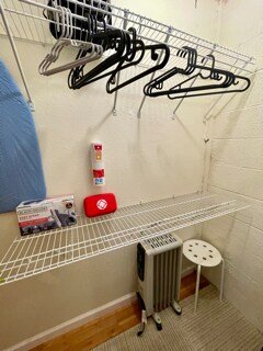 Closet with fan, iron, ironing board, portable heater, TV table - 26036 Clover Rd