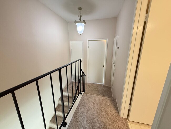 Building Photo - Move in Ready! 2BD Townhome! New Carpet! Two Patio Spaces! Attached Garage!