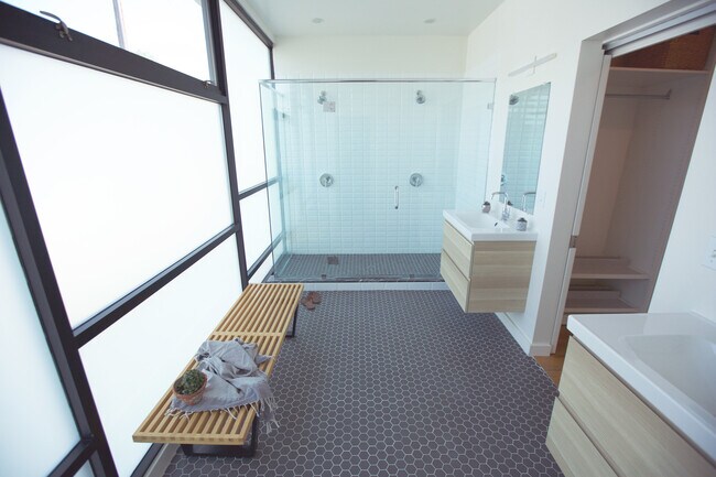 master bathroom with two sinks, two showers & toilet - 2287 Glendale Blvd