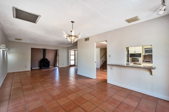 Building Photo - 6-Bedroom Residence Featuring Pool, Turf Yard & 2-Car Garage