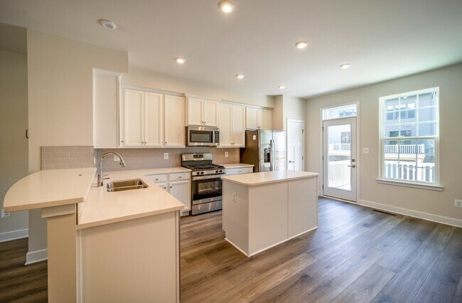 Building Photo - This 3-bedroom, 3-full bathroom townhouse offers a pristine and contemporary living experience.