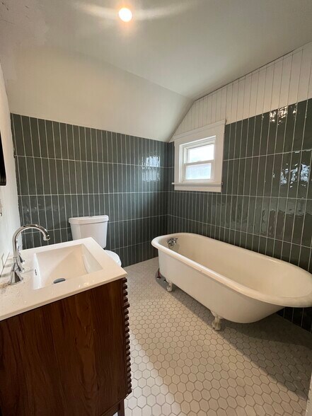 Remodeled bathroom with new tile work - 1382 E 43rd St
