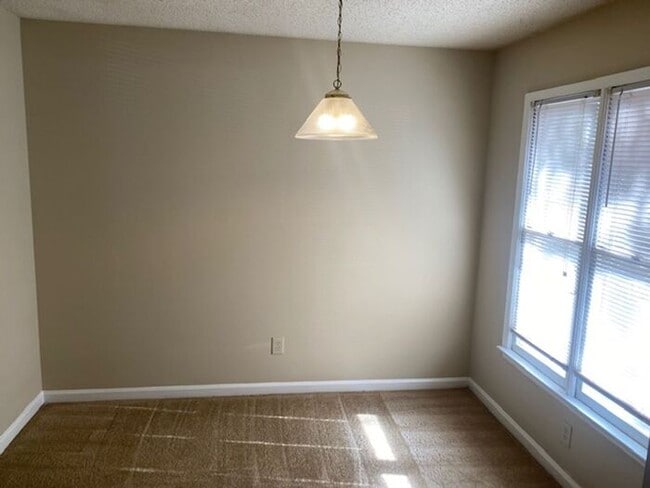 Building Photo - NOW AVAILABLE! Charming 2-Bedroom, 2-Bathroom Single-Level Townhome