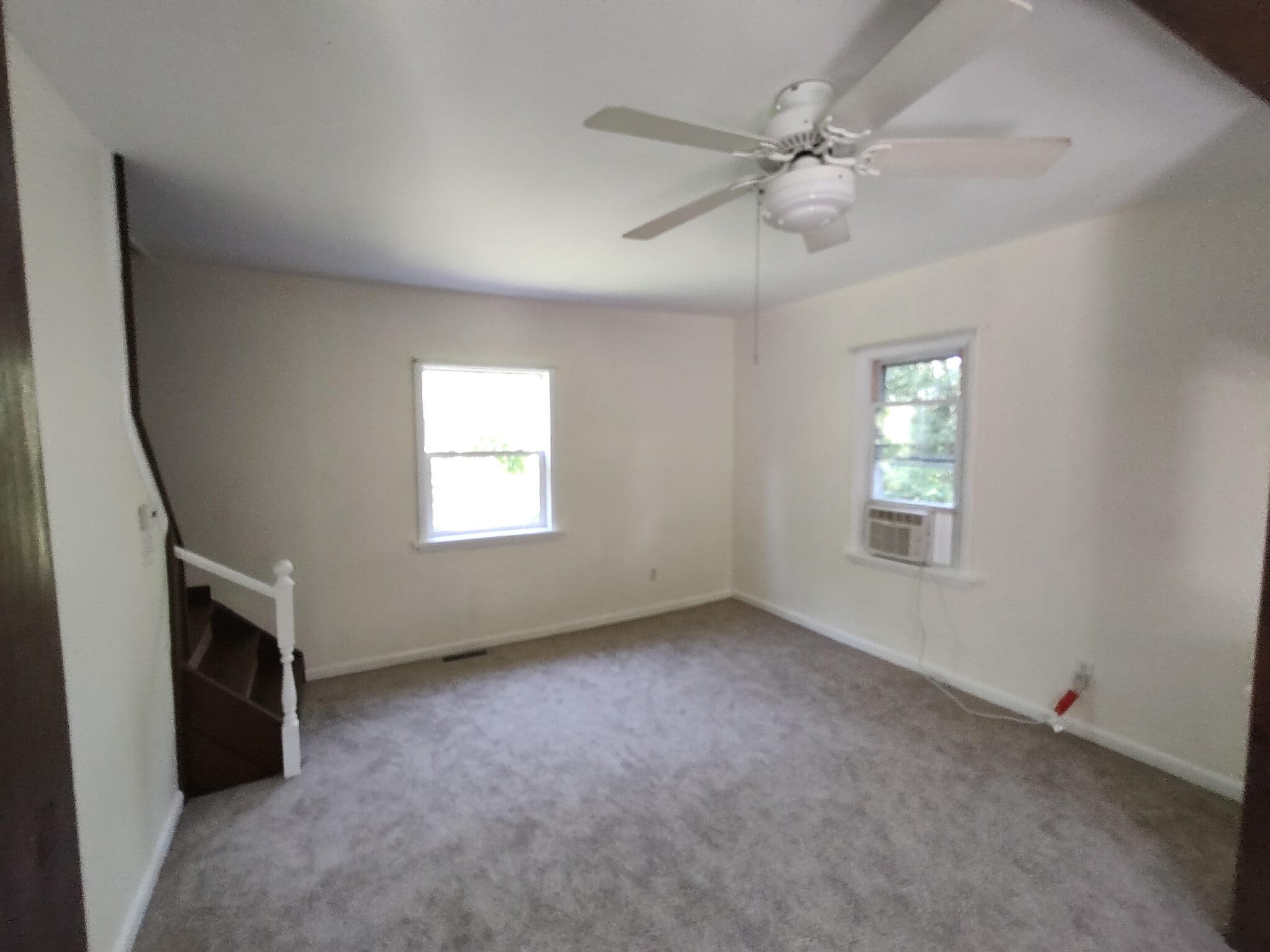 Living room and stairs to bedrooms. - 1314 Blakeley Rd