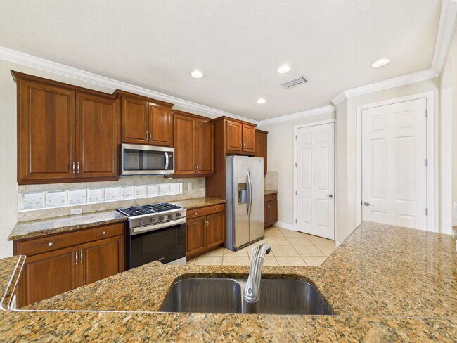 Building Photo - Luxury Lakefront Pool Home in Tesoro - Move-in Ready with Premium Inlcusions