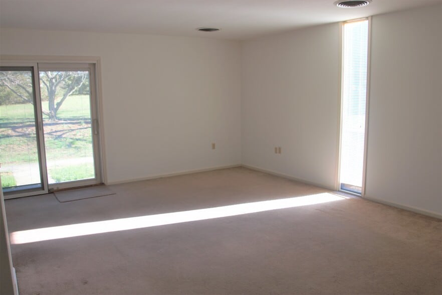 Spacious living room, open to the Dining Room. - 785 Radio Rd