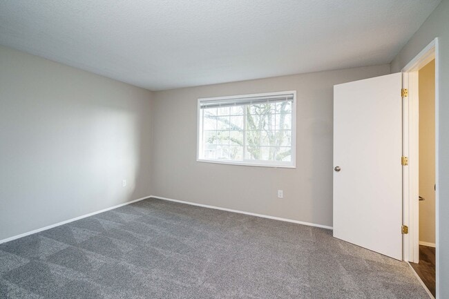Building Photo - Recently Updated with Wood Laminate Flooring and Fresh Paint