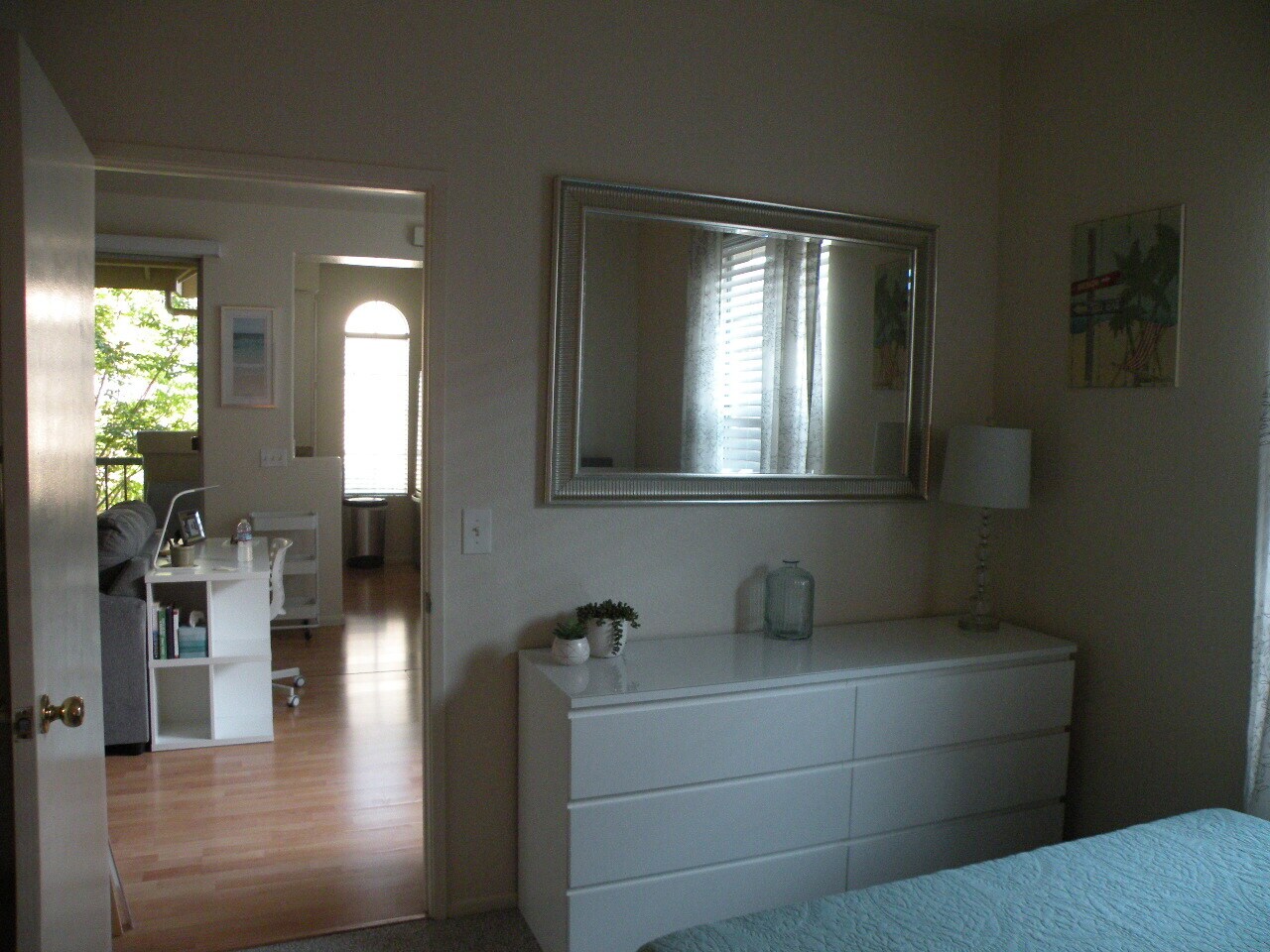 in bedroom looking out to living room kitchen and patio - 8680 New Salem St