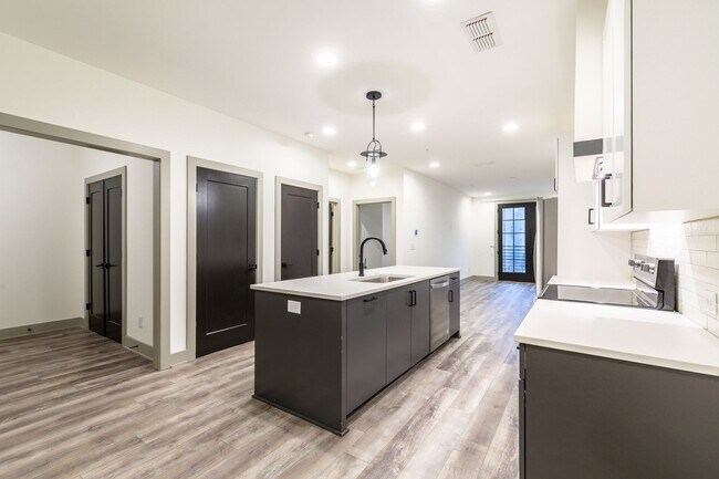 Building Photo - Modern Living Meets Walkable City Charm in...