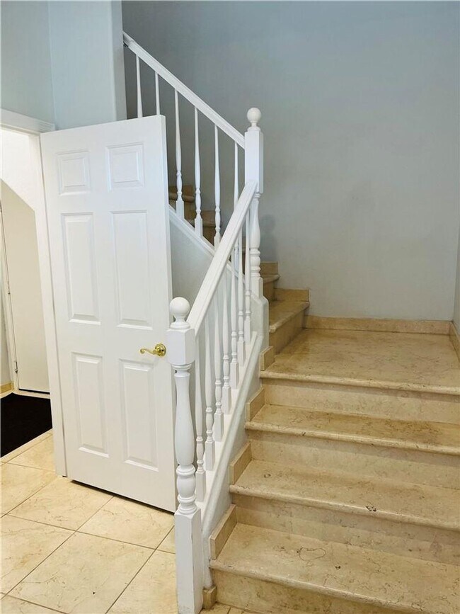 Building Photo - Amazing condominium in gated upscale neigh...