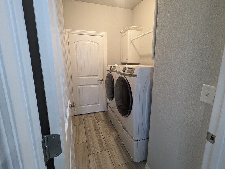 Laundry, washer/dryer included with pedestal storage - 4360 W Wales Dr