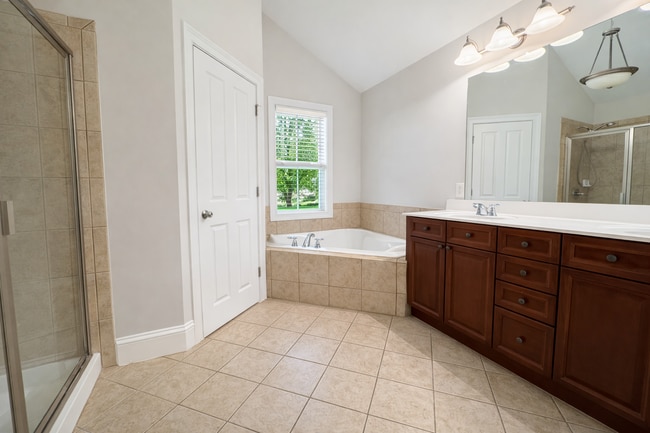 Building Photo - Gated Johns Creek Townhome Offering Space, Privacy, and Everyday Convenience