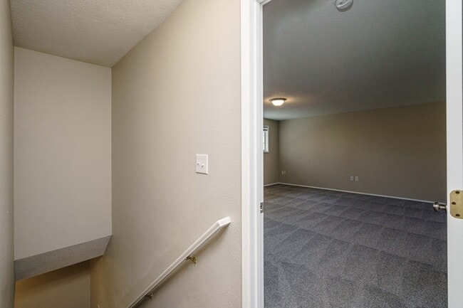 Building Photo - Recently Updated with Wood Laminate Flooring and Fresh Paint
